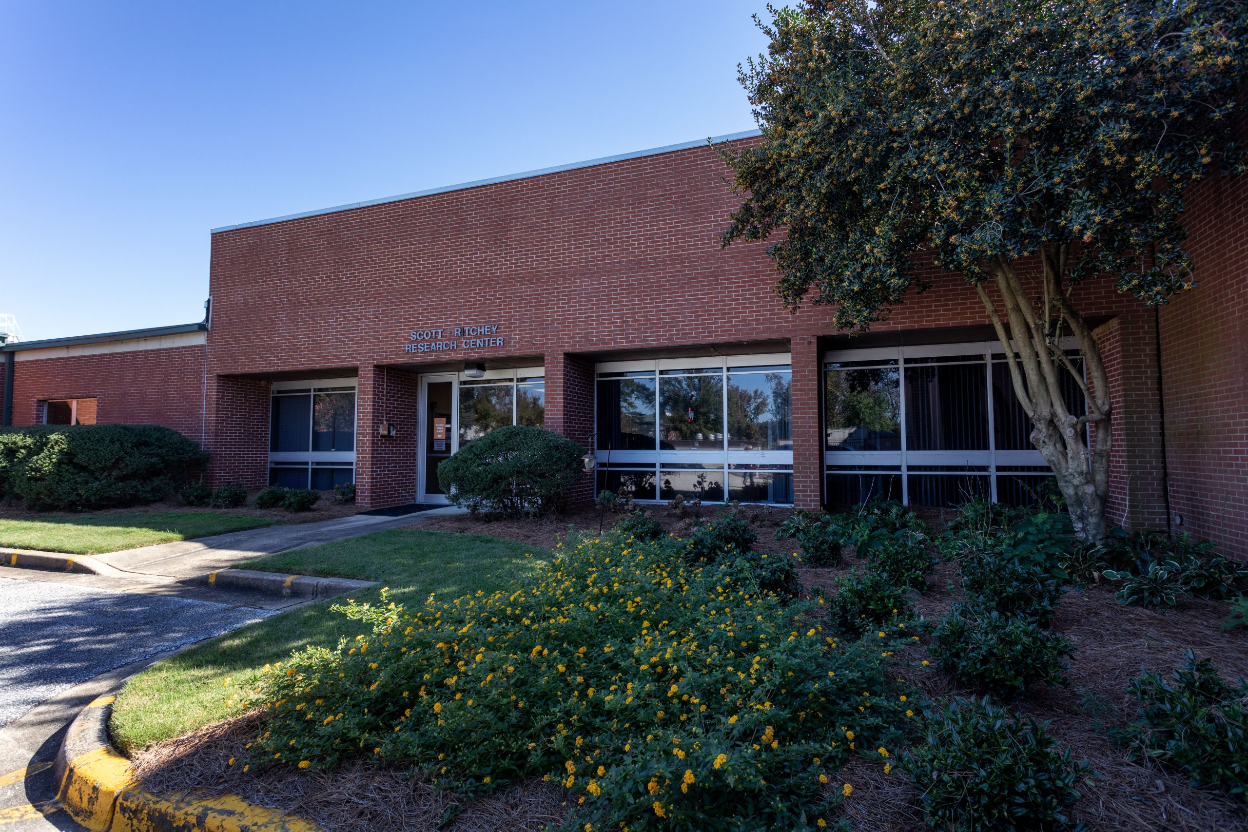 Red brick building with sign that reads Scott-Ritchey Research Center